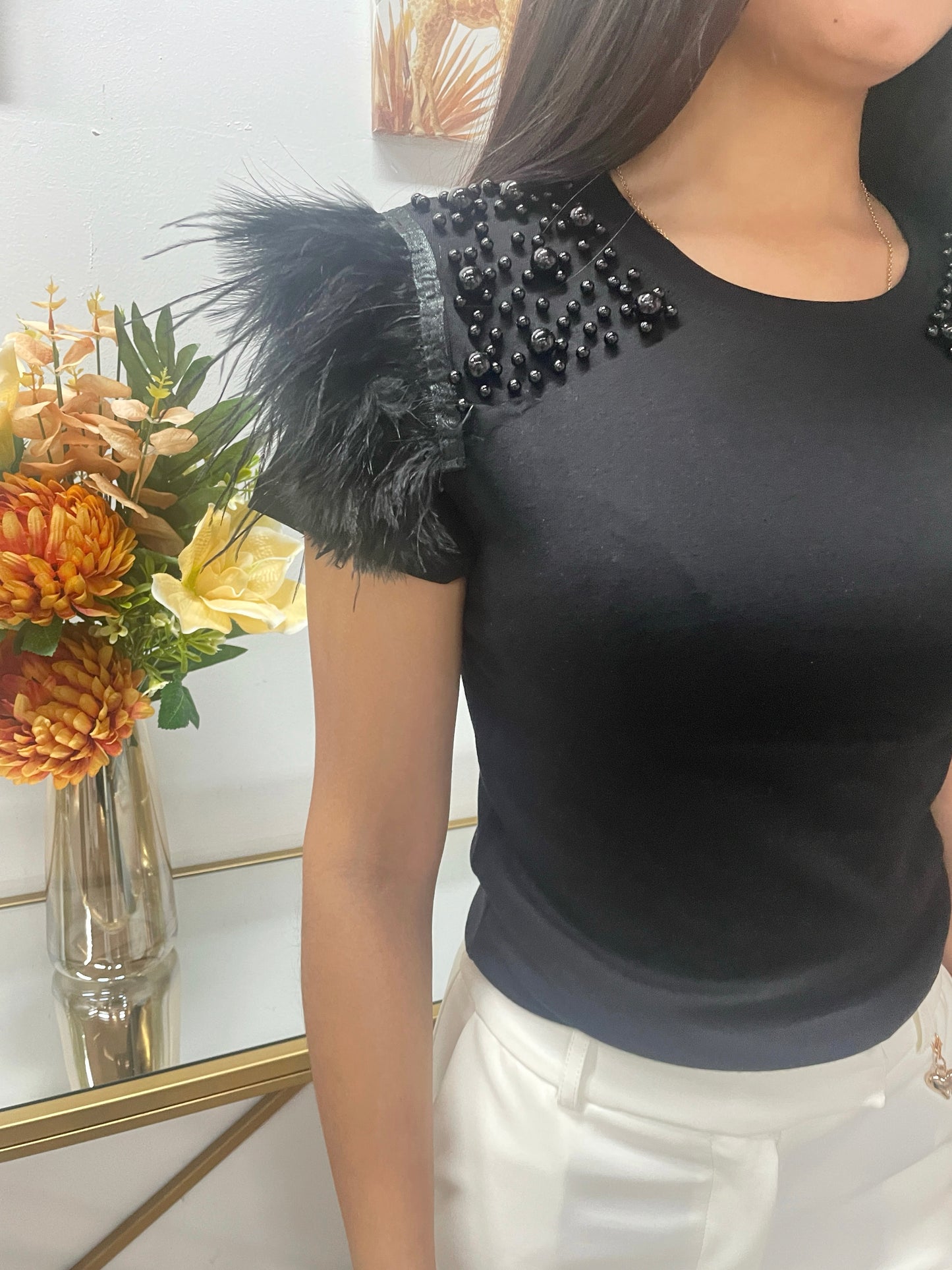 Camiseta de perla y pluma